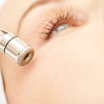 Microdermabrasion clinic treatment. Aesthetic facial procedure. Diamond face clean. Medicine beauty anti acne and hyperpigmentation cosmetic. Cosmetologist hand.